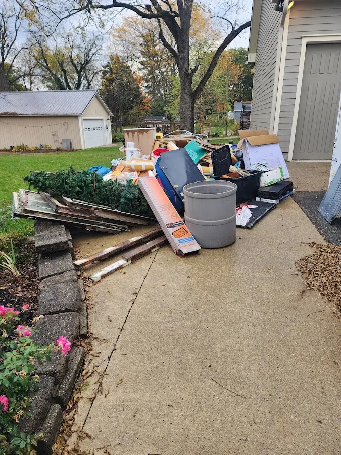Dumpster being loaded with debris for 30 Yard Dumpster Rental in Merchantville